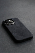 Black phone case on a dark gray surface
