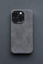 Gray phone case with a textured finish on a dark gray background