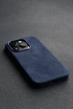 Blue phone case on a dark gray surface