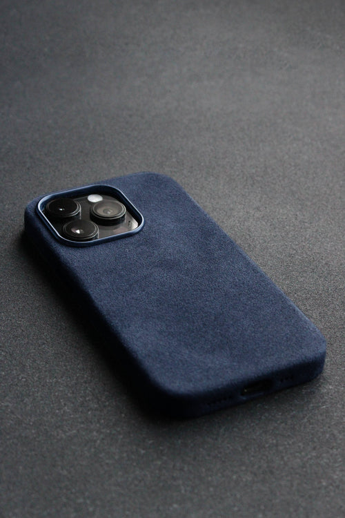 Blue phone case on a dark gray surface