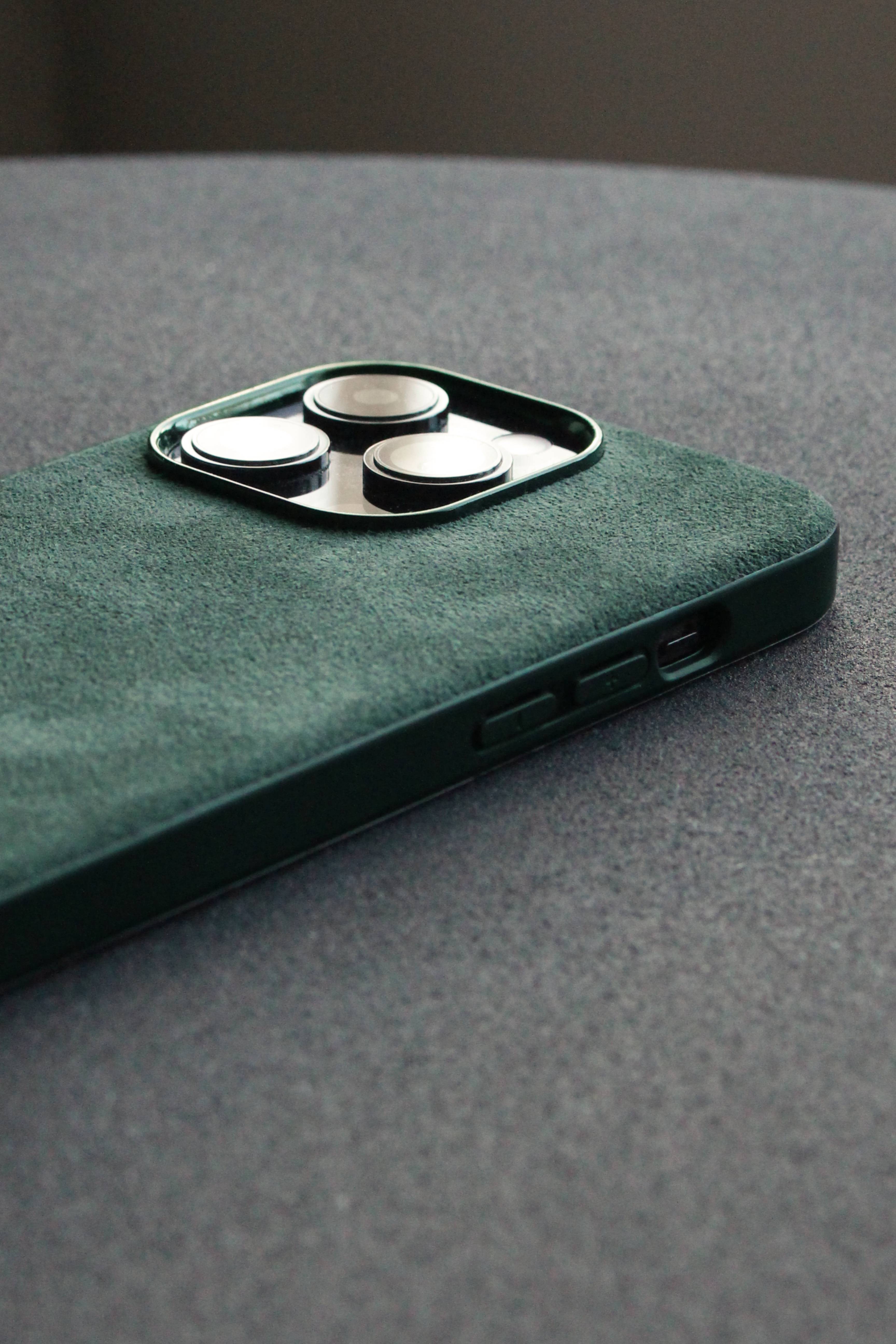 Green phone case on a gray surface