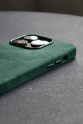 Green phone case on a gray surface
