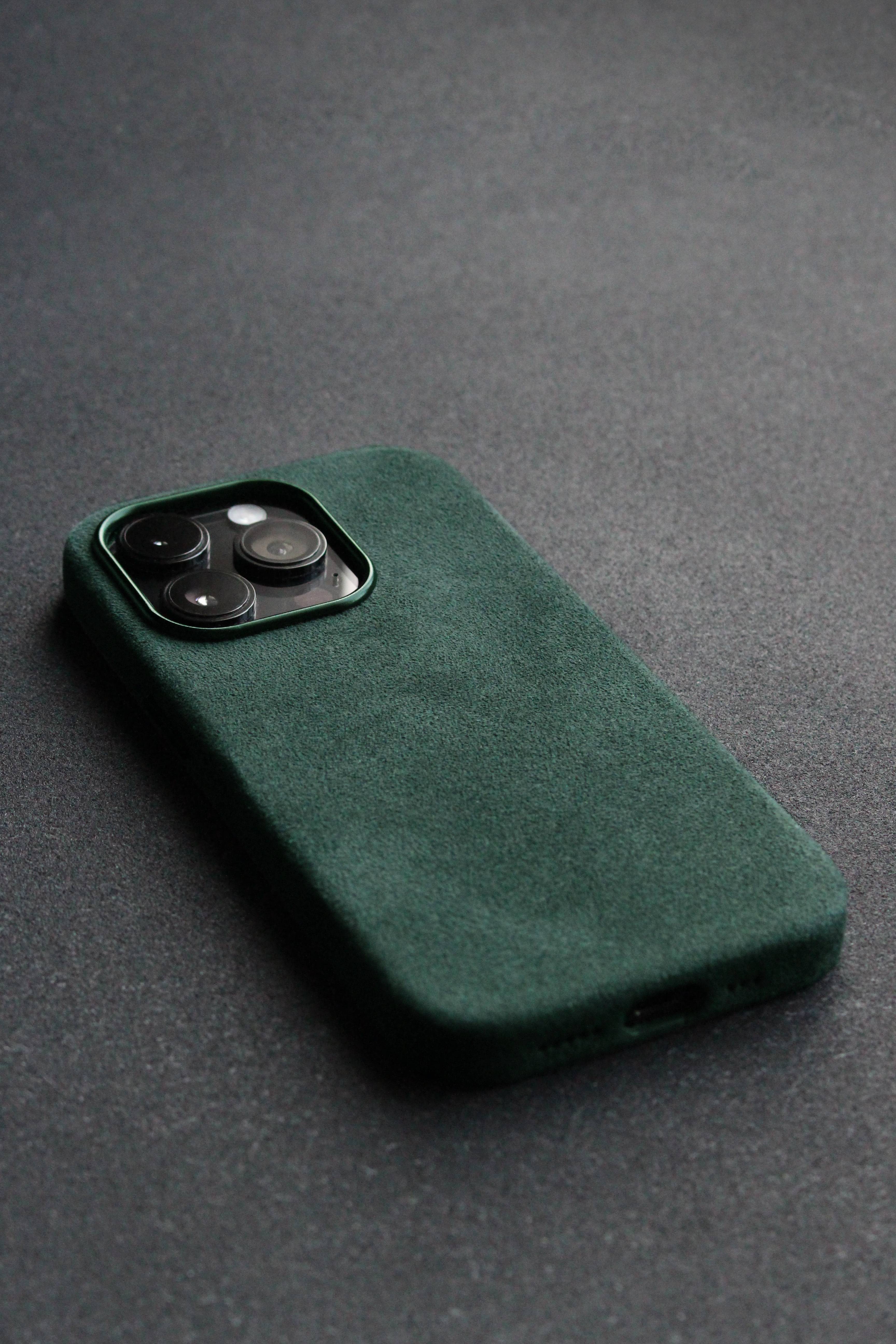 Green phone case on a dark gray background